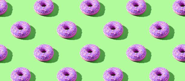 istock doughnut seamless pattern. Bright color. Tasty unhealthy food 1222668191