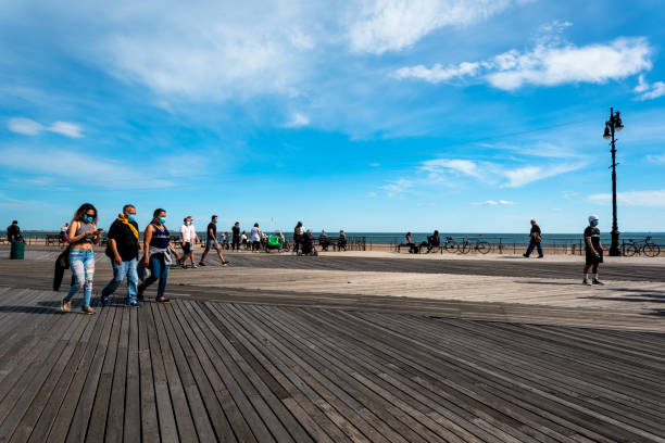 Pier and view over the beach and amusement park at Coney Island, New York.