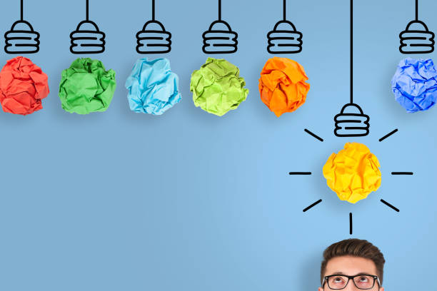 istock Creative Idea Concepts with Light Bulb Crumpled Paper on Blue Background 1222671246
