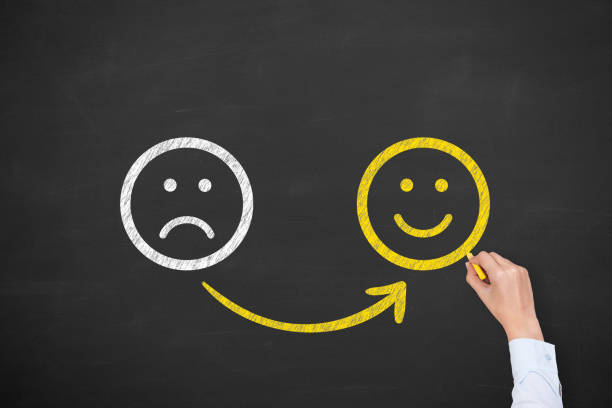 istock Hand Drawing Unhappy and Happy on Blackboard 1222671263