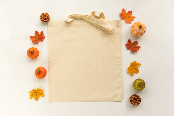 Blank autumn / fall themed canvas tote shopping bag mockup flat lay
