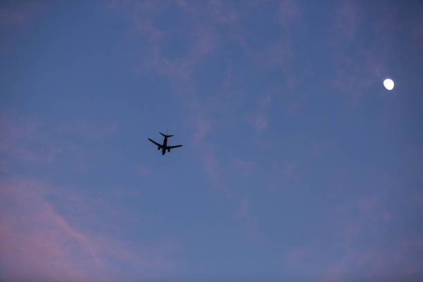 istock Airplane about to land during the sunset 1222687533