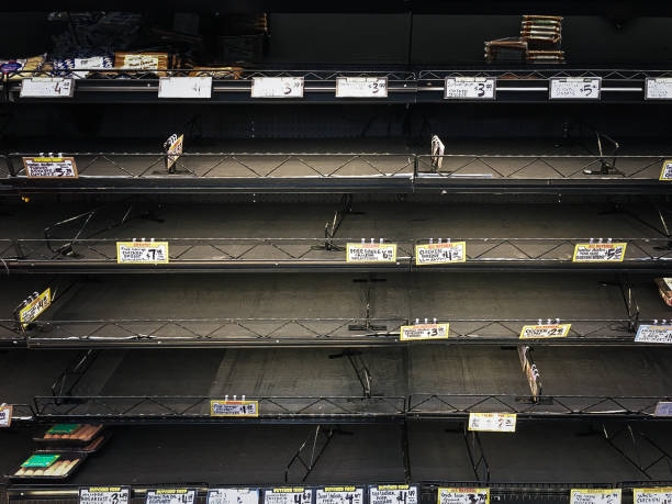 Empty Grocery Shelves During Epedimic Empty store shelves with food and supplies shortage during virus epidemic. sold out photos stock pictures, royalty-free photos & images