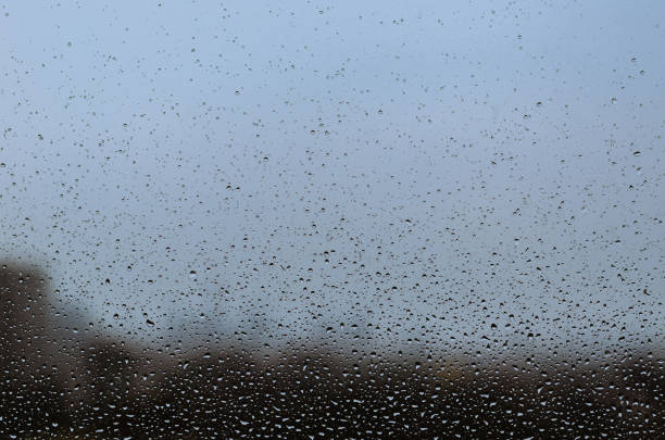 istock Rain drop on glass window in monsoon season. 1222691415