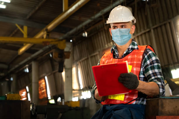 istock Factory workers with face mask protect from outbreak of Coronavirus COVID-19 1222691508