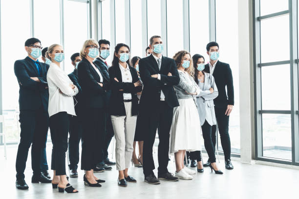 istock Confident business people with face mask protect from Coronavirus or COVID-19. 1222691585