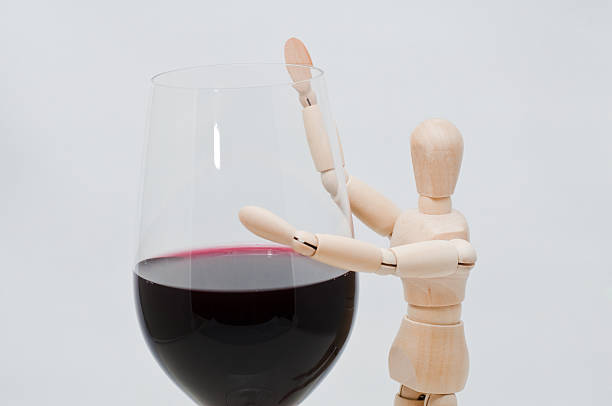 istock Mannequin holds a wineglass 122269339