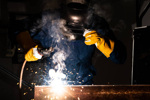 istock Metal welder working with arc welding machine. 1222697259