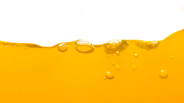 istock Orange water surface with bubble and water splash on white background 1222698528