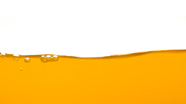 istock Orange water surface with bubble and water splash on white background 1222698536