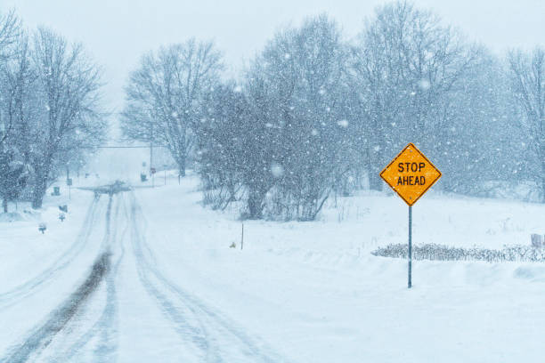istock Winter Snow Blizzard Rural Stop Ahead Road Sign 1222702278