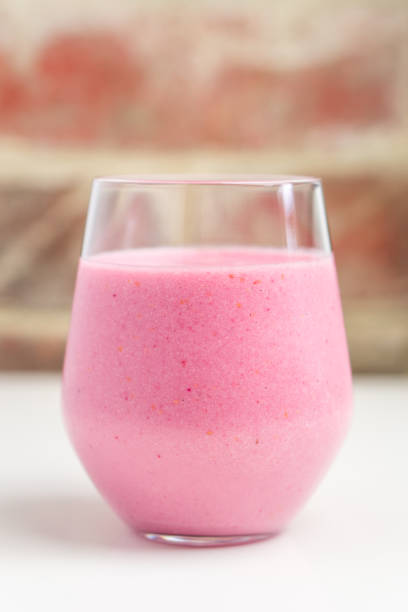 istock glass of raspberry and banana smoothie 1222703671
