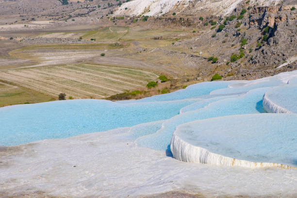 istock Travertine terrace formations and pools at Pamukkale (cotton castle), Denizli, Turkey 1222704695
