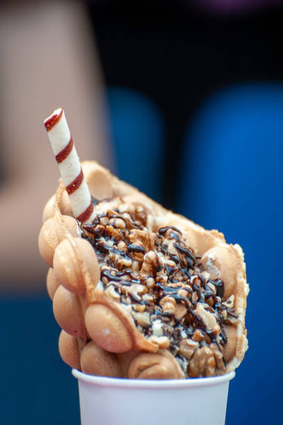 istock Delicious sweet bubble waffle on table 1222706129