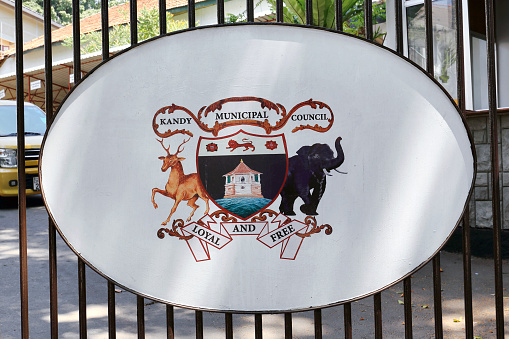 Kandy, Sri Lanka - February 11, 2020: Signboard Kandy Municipal Council on the fence