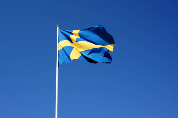 Sweden flag waving against the clear blue sky