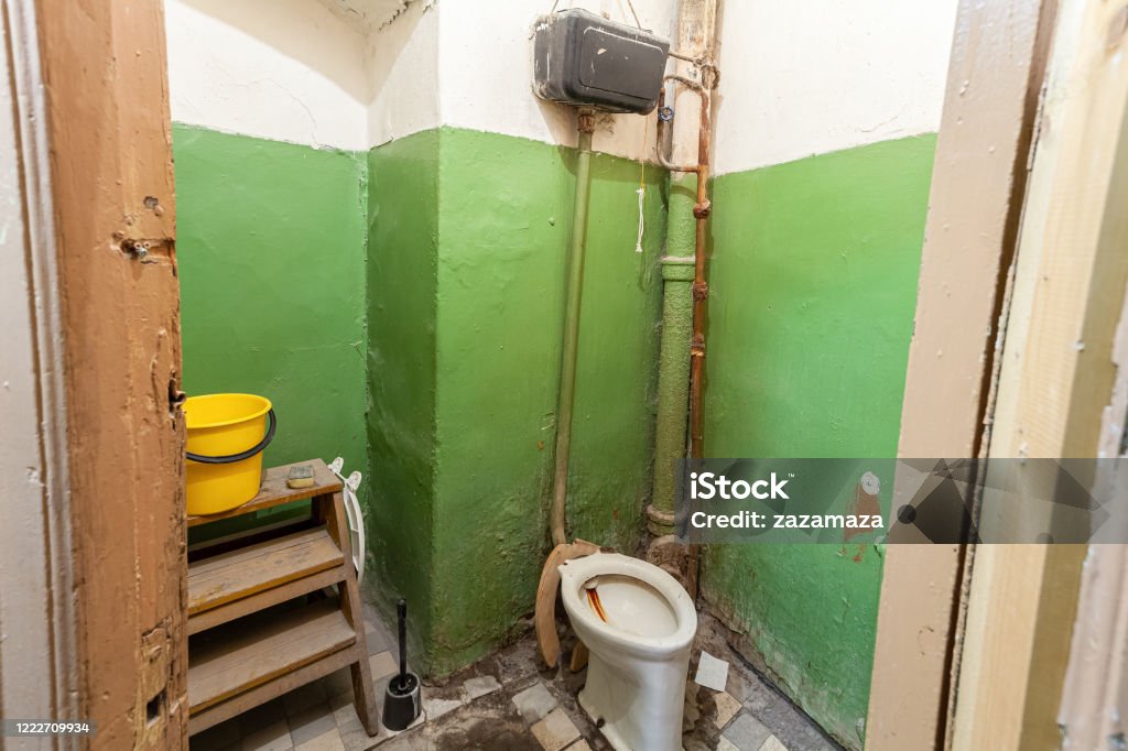 Old and dirty toilet in the  apartment that is prepared to demolition  is the  place for refugees for temporary period of  living and existence Poverty Stock Photo
