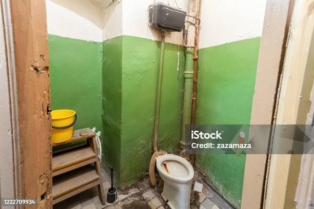 Old And Dirty Toilet In The Apartment That Is Prepared To Demolition Is The Place For Refugees For Temporary Period Of Living And Existence Stock Photo - Download Image Now