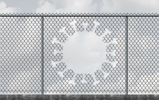 Virus freedom and lockdown escape concept as a chain link fence with a hole shaped as a contagious viral cell as a reopening after a pandemic outbreak or escape quarantine from disease as a 3D render.
