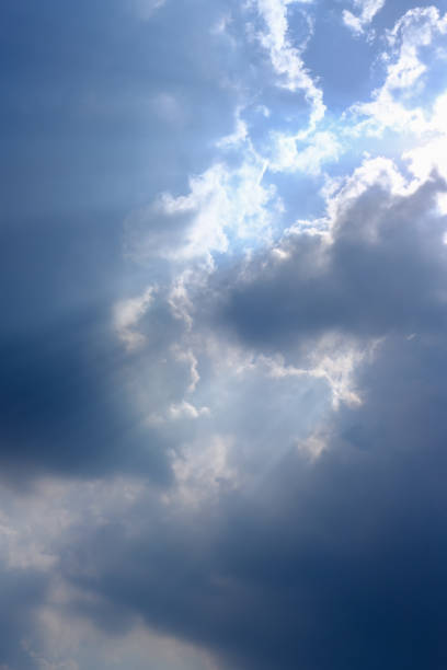 istock Sunbeam, sunlight through the haze, cloud on the blue sky . Cloud with sun ray. 1222713633