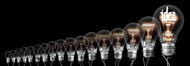 istock Dark and Shining Light Bulbs with Idea Concept 1222713680
