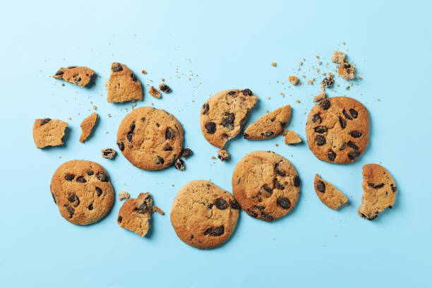 istock Tasty chocolate chip cookies on blue background, top view 1222714273
