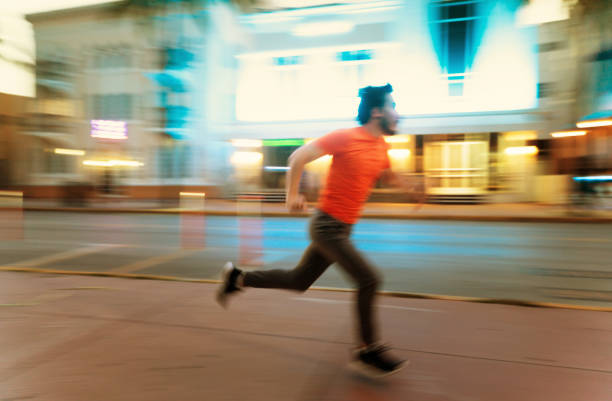 istock Cuban Millennial running in Ocean Drive 1222714534