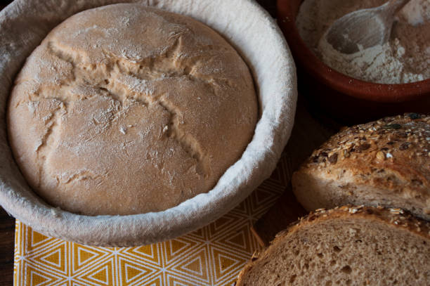 istock sourdough dough in proofing basket ,before baking, whole wheat recipe. Rye flour. Home made seed bread. 1222716924