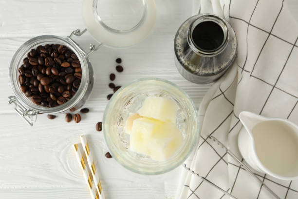 istock Composition with ice coffee on white wooden background 1222717456