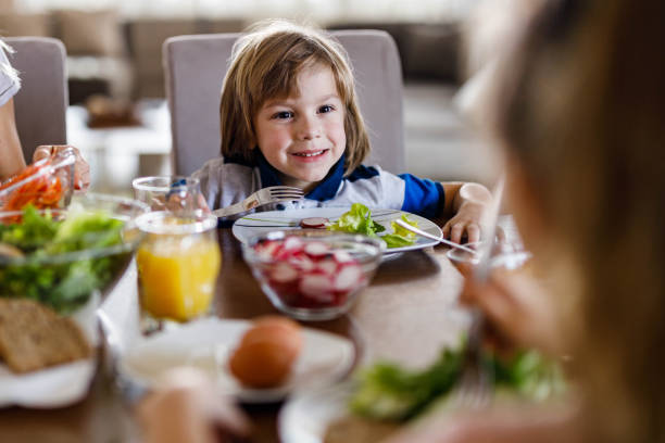 istock Happy little boy during lunch time in dining room. 1222718548
