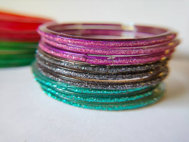istock Bangles on white background. Indian traditional ornaments image. Colorful bangles on plain background. Symbol of married woman. 1222720167