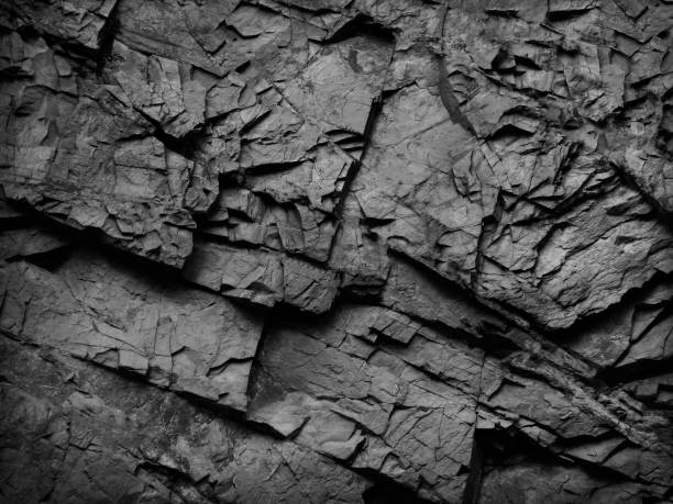 istock Black stone grunge background. Rock texture. Close-up. Black and white abstract background. 1222721019