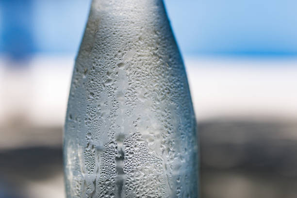 close up view of the glass ice cubes and water