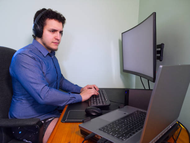 istock Young caucasian programer man in underwear with headphones thinking about a work problem 1222721967