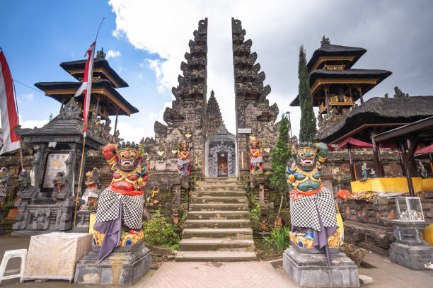 Besakih, Indonesia - August 23, 2014: Visitors explore the immense Pura Besakih Temple (aka Mother Temple of Besakih). the most important, the largest and holiest Hindu temple in Bali.