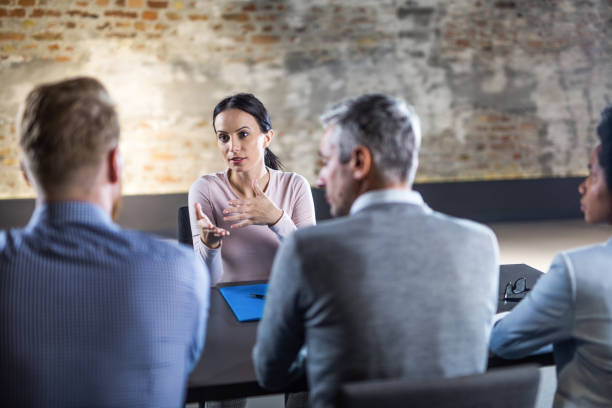 istock Female candidate talking to business team on a job interview. 1222723643