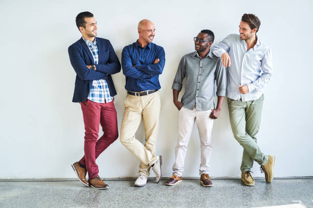 Happy multi-ethnic businessmen talking at office