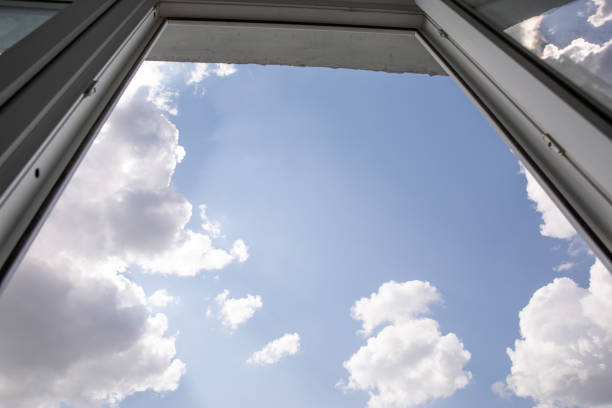 istock View of clouds to the sky from the window 1222726473