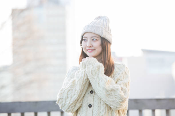 istock Asian young woman in winter clothes 1222727014