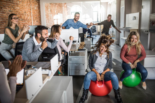 istock Cheerful colleagues having fun during space hopper at corporate office. 1222727930