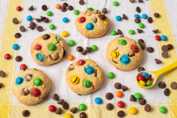 istock Multi-colored chocolate candy dragees and Chocolate Chips Homemade Cookies 1222728327