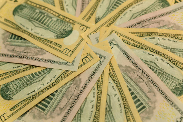 istock background of ten dollar and five dollar bills. 1222731006