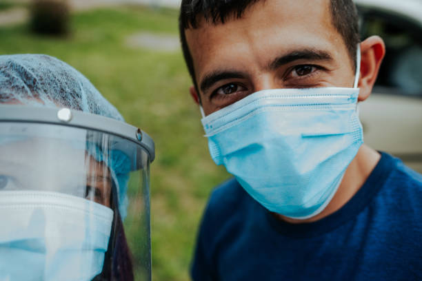 Health care workers during a break Health care workers during a break frontline worker mask stock pictures, royalty-free photos & images