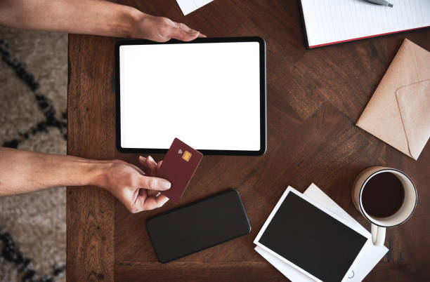 istock Female holding digital tablet and bank card 1222732157