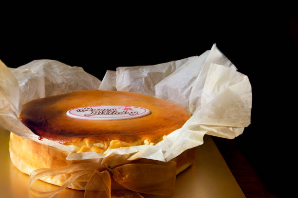Birthday Celebration with Basque burnt cheesecake with happy birthday text isolated on black background