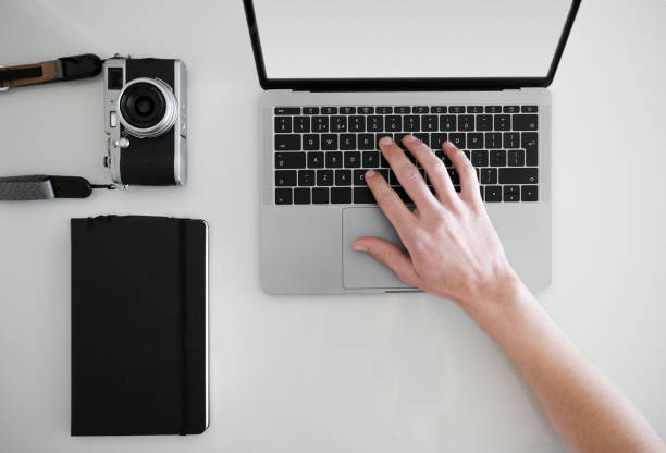 istock Man typing on laptop from above 1222732895