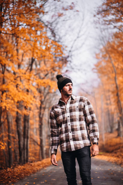 istock man alone in a autmnal road 1222734417