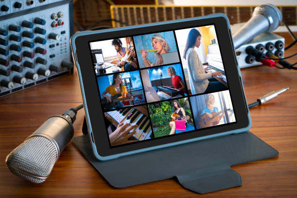 istock Music teleconference with tablet on wood table microphone music stuff 1222735936