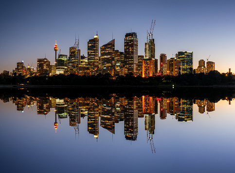 Looking across the still waters of Sydney Harbour towards the imposing towers of the city's Central Business District. Composite image.