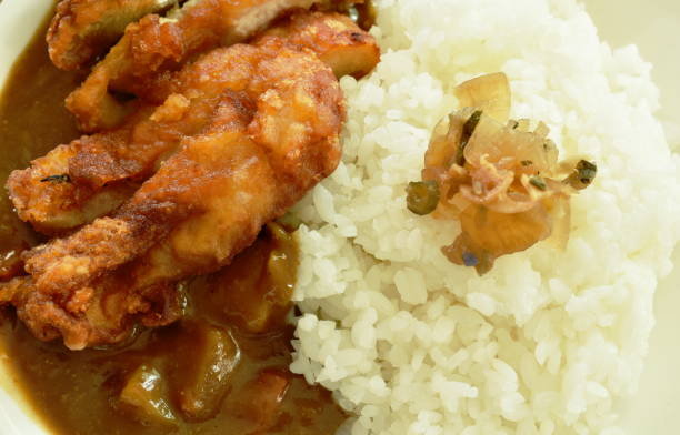 istock deep fried chicken dressing with Japanese curry on rice topping slice pickled cabbage 1222736772